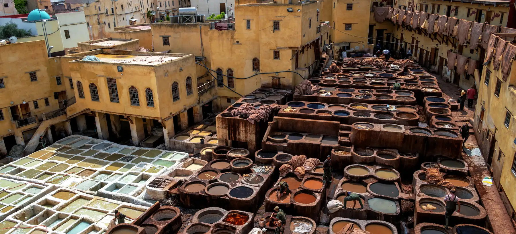 The stone dye vats of the Chouara Tannery in Fez, seen from above